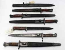 An Australian 1944 Owen Bayonet together with 6 other bayonets.