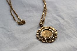 A Victorian shield back half sovereign dated 1863 together with a 9ct yellow gold slip mount and a