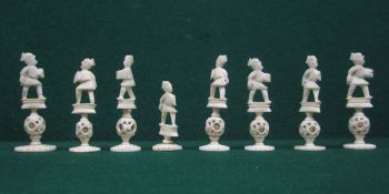 A 19th century Chinese export carved ivory part chess set, one side stained red, the opposing side