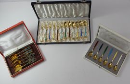 A set of six silver gilt and enamel Georg Jensen cased tea spoons, cased together with cased