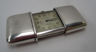 A Movado Chronometre Ermeto ladies silver purse watch, the square dial with Arabic numerals, No.