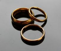 Three 22ct yellow gold wedding bands, approximately 19 grams