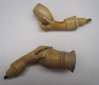 A Meerschaum duo pipe in the form of hand holding a bowl (cased), together with other pipes and a