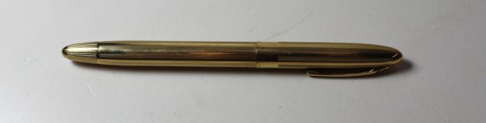 A Sheaffer's yellow metal fountain pen with 14k nib and yellow metal barrel in a case.