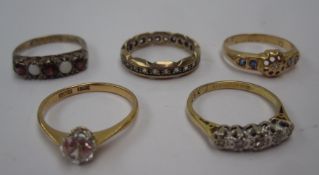 A sapphire and diamond ring, a five stone diamond ring, garnet and opal ring and two dress rings