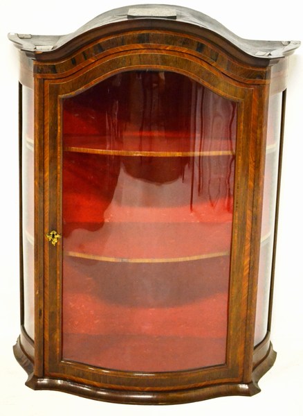 A 19TH CENTURY WALNUT AND INLAID CONTINENTAL DISPLAY CABINET the arched moulded top above a