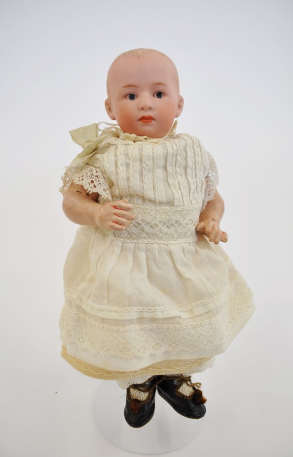 Late 19th/early 20th Century Gerbruder Heubach bisque-head doll impressed "6894 Germany". Bisque