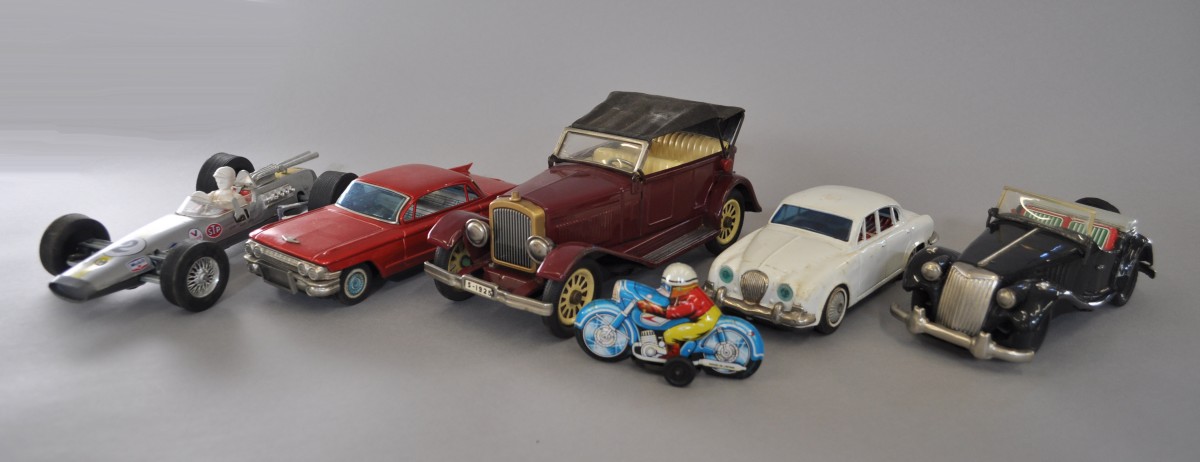 Selection of assorted tinplate vehicles, includes Bandai Cadillac in red, and a battery operated