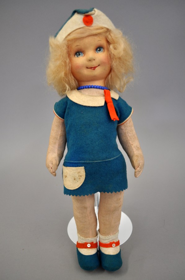 Cloth Stockinet Girl Doll: with large blue painted eyes, blonde curly wig, white cotton undergarment
