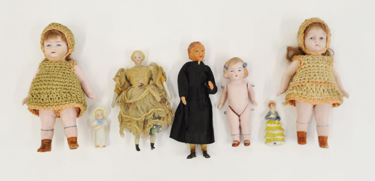 Six assorted late 19th/early 20th Century miniature porcelain dolls, together with a small