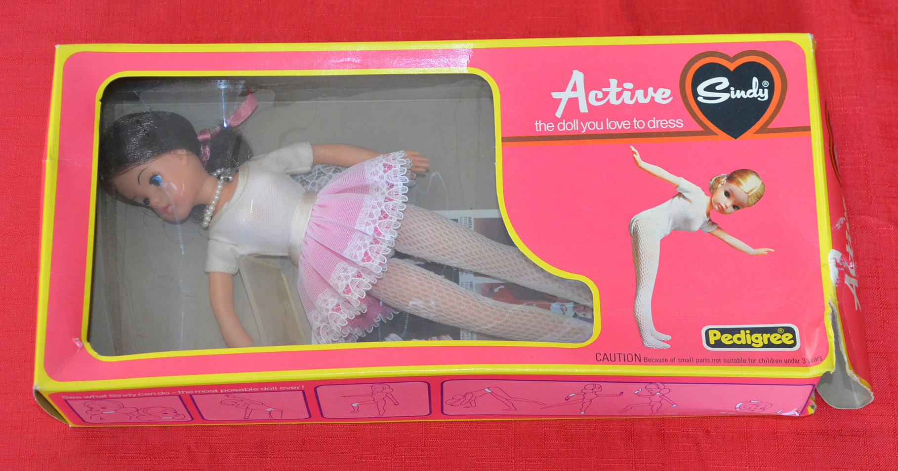 Pedigree Active Ballerina Sindy #44654, with brunette hair, wearing pearl necklace, bodice, tutu,