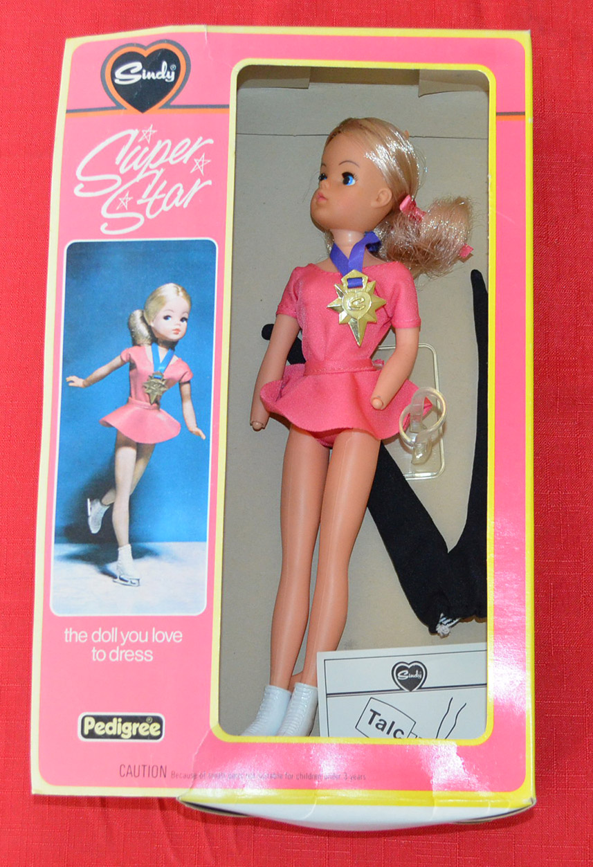 Pedigree Sindy 44614 Super Star: blonde doll wears pink bodice with matching skirt, medal on