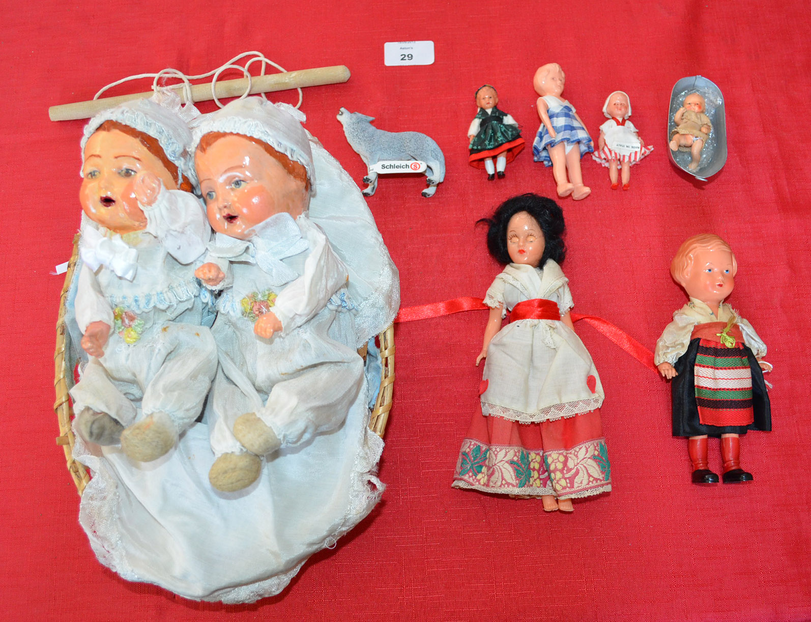 Pair of baby dolls in painted hard papier mache composition, likely German early 20th Century, as