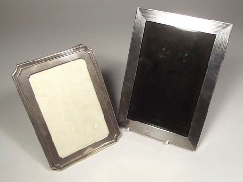 PHOTOGRAPH FRAMES
An engine turned, silver mounted photograph frame, 21 x 15cm & a smaller frame