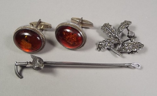 AMBER ETC.
A pair of modern, silver mounted cufflinks & two other silver pieces.