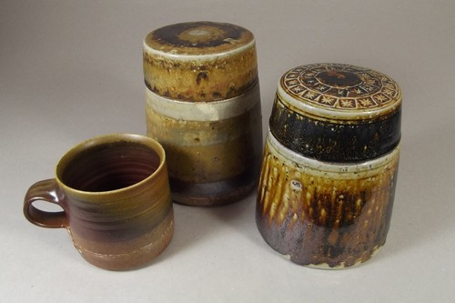 MARY RICH
Two Mary Rich stoneware lidded jars & a coffee mug. All marked. Height of jars 13cms.