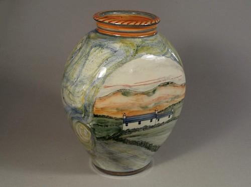 ADRIAN BROUGH
An Adrian Brough vase decorated with Cornish cottages in a landscape. Signed. Height