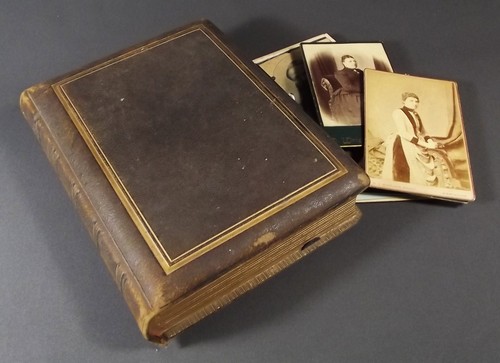 PHOTOGRAPH ALBUM 
A Victorian leather bound photograph album containing many portraits, family