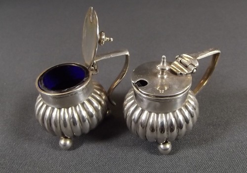 A PAIR OF SILVER MUSTARDS
A pair of Victorian, fluted mustards.