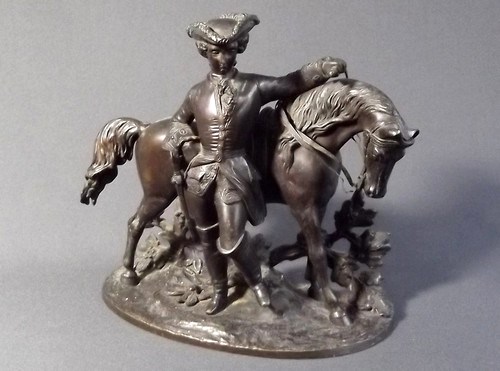 BRONZE HORSEMAN
A good bronze of a gentleman in 18th century dress standing before his horse. Height