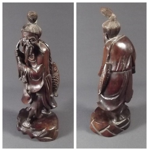 ORIENTAL CARVING
An oriental carved figure of a fisherman. Height 12 ins.