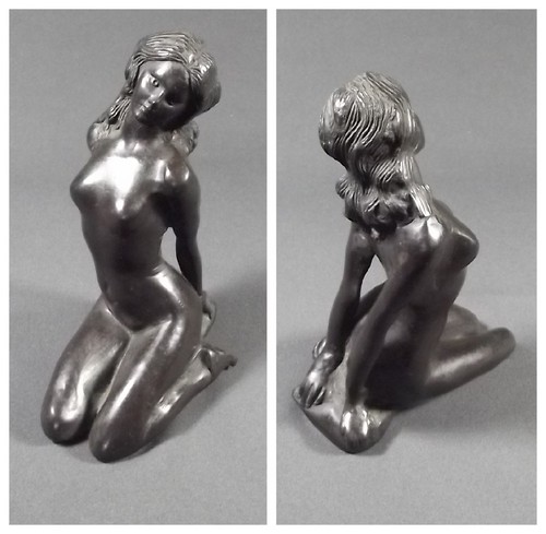 BRONZE NUDE
A bronze model of a seated nude. Height 7 ins.