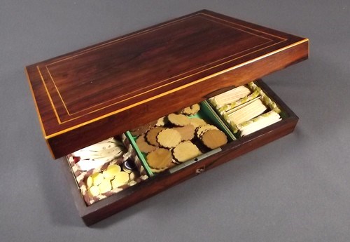 ROSEWOOD GAMES BOX
A late 19th century rosewood games box, retailed by A.Giroux & Cie, Paris. Filled