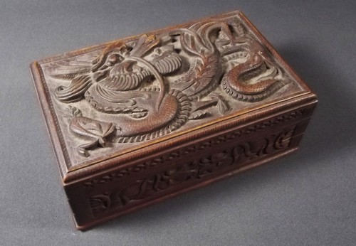 CHINESE BOX
A dragon carved Chinese wooden box with hidden opening.