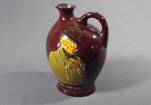 ROYAL DOULTON FLASK
A Royal Doulton Micawber flask, height 8 ins.