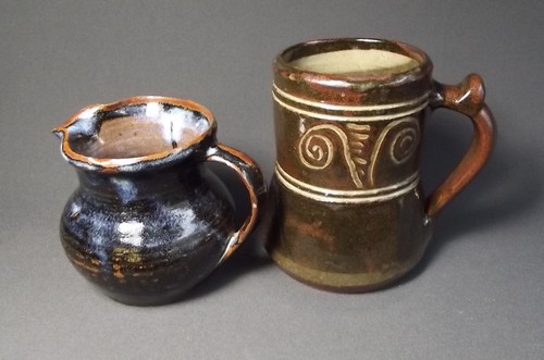 ABUJA POTTERY
Two pieces of Nigerian Abuja Pottery. A pint tankard marked 'ABUJA POTTERY' & jug with