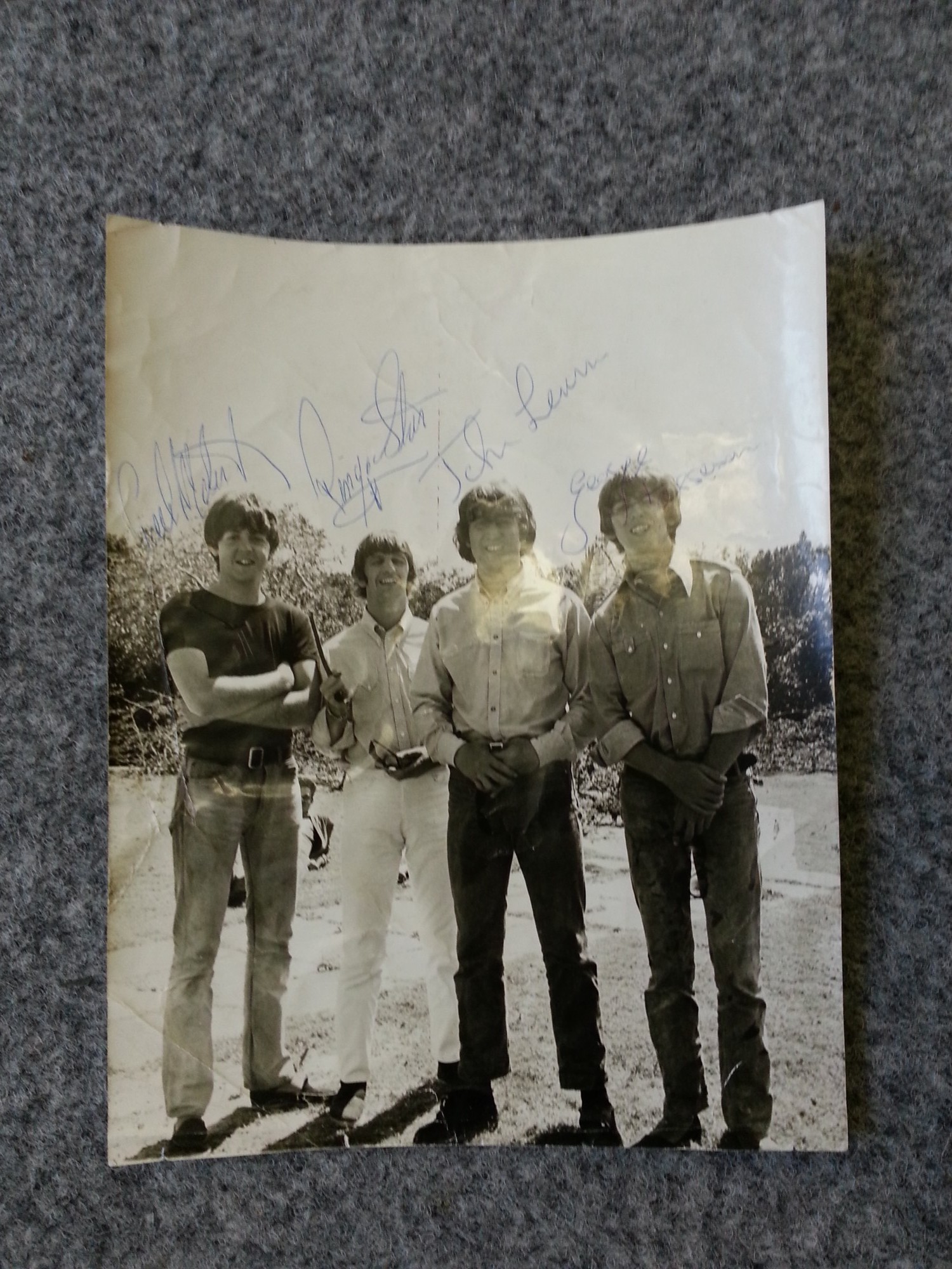 Rare signed photograph of The Beatles taken in 1965 during the filming of `Help`. Acquired by a