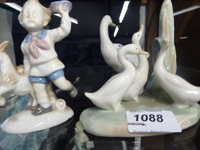 NAO FIGURE OF GEESE AND FIGURE OF A BOY WITH A GOAT