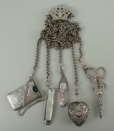 A Victorian silver five strand chatelaine, Birmingham 1898, holding scissors in a sheath, folding '