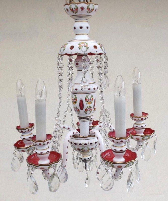 A late 19th century Bohemian white flashed on cranberry glass six branch chandelier, with hand