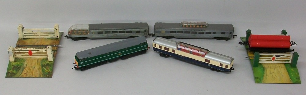 A quantity of trains, including a Tri-Ang Deisel D5572 and two observation cars, a Hornby 'O'