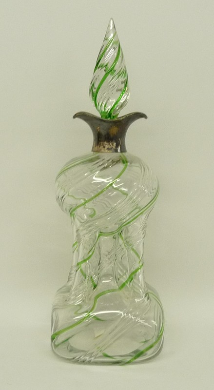 A Victorian cut glass hour glass decanter with green spiral fluting, possibly James Powell, with a