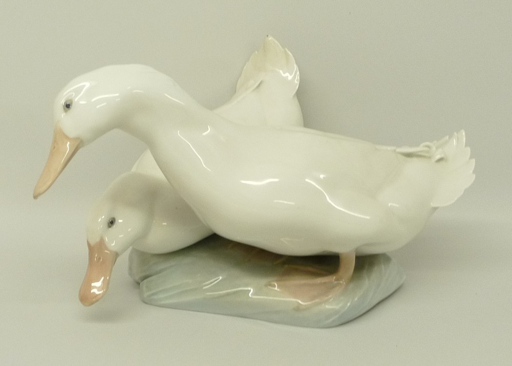 A Royal Copenhagen porcelain model of a pair of ducks, number 412, printed and painted marks, 32