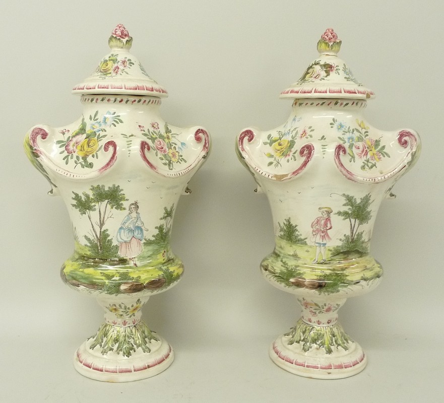 A pair of French faience pottery vases and covers, possibly Veuve Perrin, of baluster form,