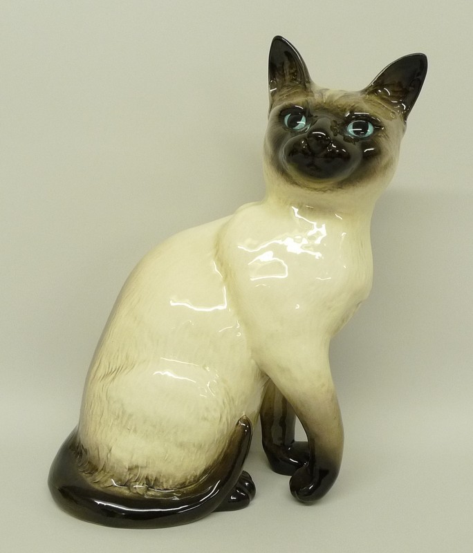 A Beswick pottery figure of a Siamese cat, number 1882, impressed and printed marks.