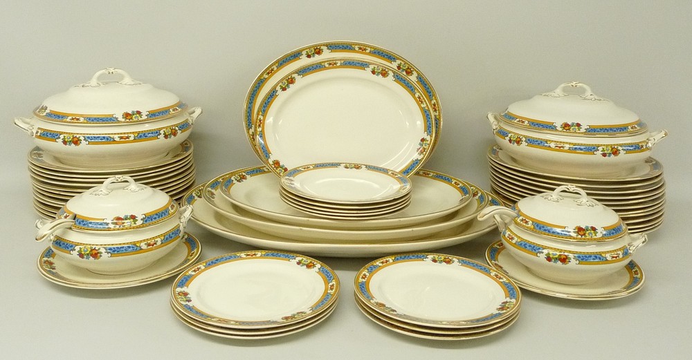 A Keeling & Co, 1930s, Losol ware dinner service, decorated with a floral band and gilt detail,