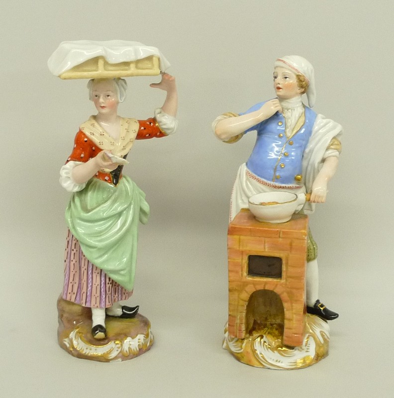 A pair of Meissen Cries de Paris figures, early 19th century, modelled as a scallop seller with a