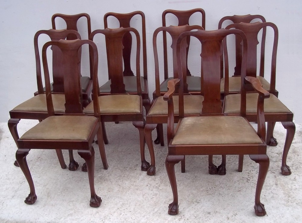 A set of eight plus two Queen Anne style chairs, circa 1910, including a carver, with ball and