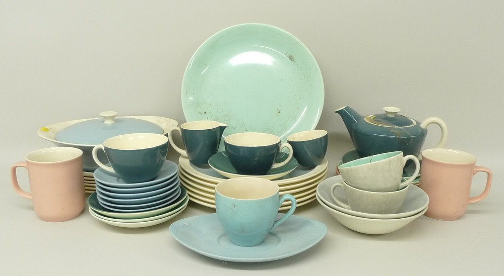 A Poole pottery mixed twin tone tea service including teapot, cups and saucers, and pale blue