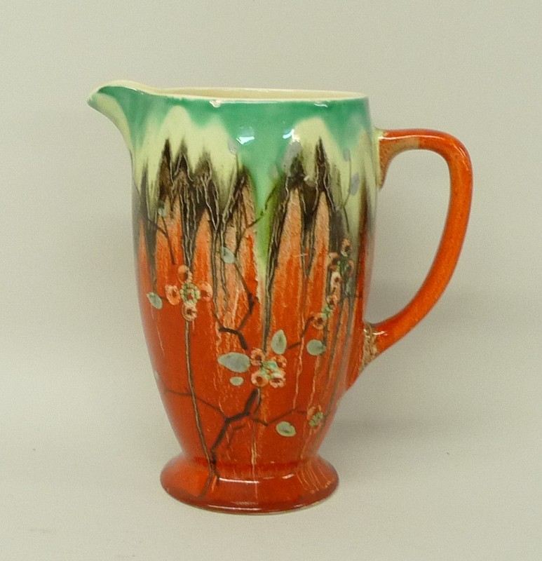 A Clarice Cliff, Bizarre, pottery jug decorated in the 'Cherry Blossom' pattern, printed mark,