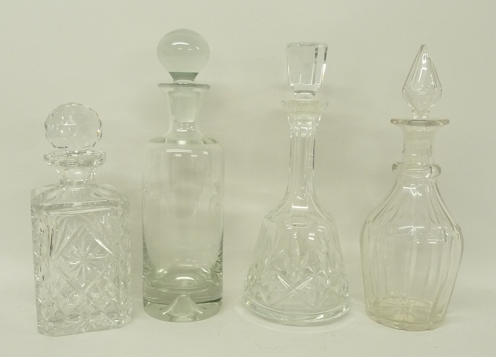 A group of cut glass decanters, one etched with Royal Air Force station Laabruel, one of smaller