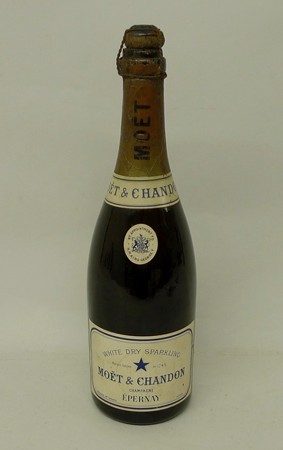 Vintage Champagne: a bottle of Moet & Chandon Champagne, late 1920s, foil missing, 2cm inverted.