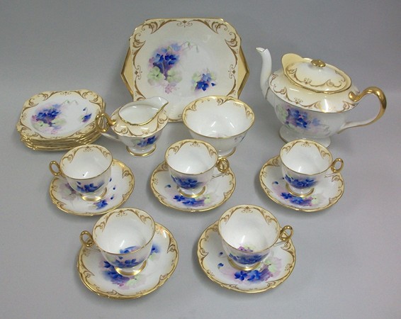 A Shelley porcelain part tea service decorated in blue with violets, pattern 12352, comprising