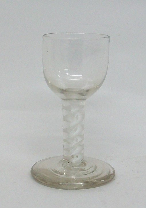 A George III cordial glass, late 18th century, the round bowl above a double opaque twist stem and