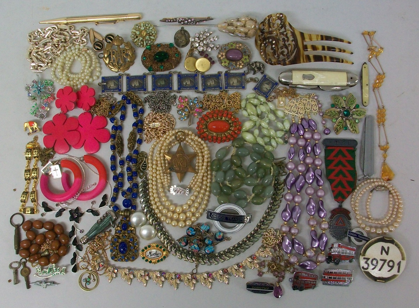 A quantity of costume jewellery including necklaces, earrings and brooches, together with an