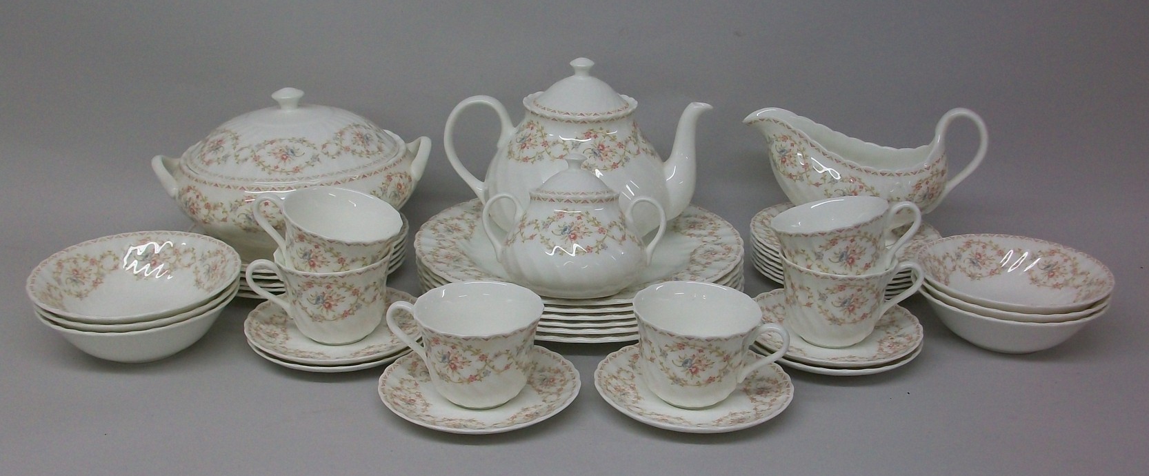 A Wedgwood porcelain part dinner and tea service, decorated in the `Ophelia` pattern, comprising;